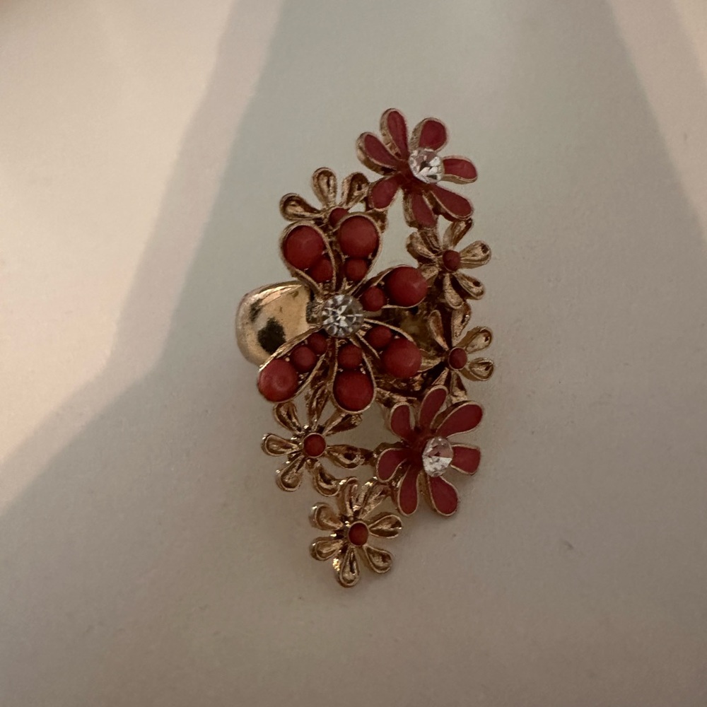 Gold and peach floral ring.  The ring stretches to accommodate size.